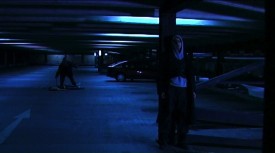 Soul Searcher's car park scene, lit almost entirely by the existing overhead fluorescents
