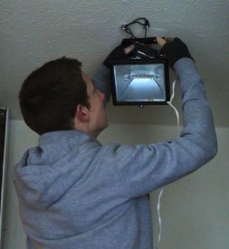 Col rigs a worklight to the ceiling