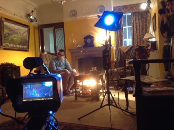 Setting up for the first living room scene. The crossed dedos can be seen in the top left and top right, while the dedo in the foreground is solely to produce lens flare.